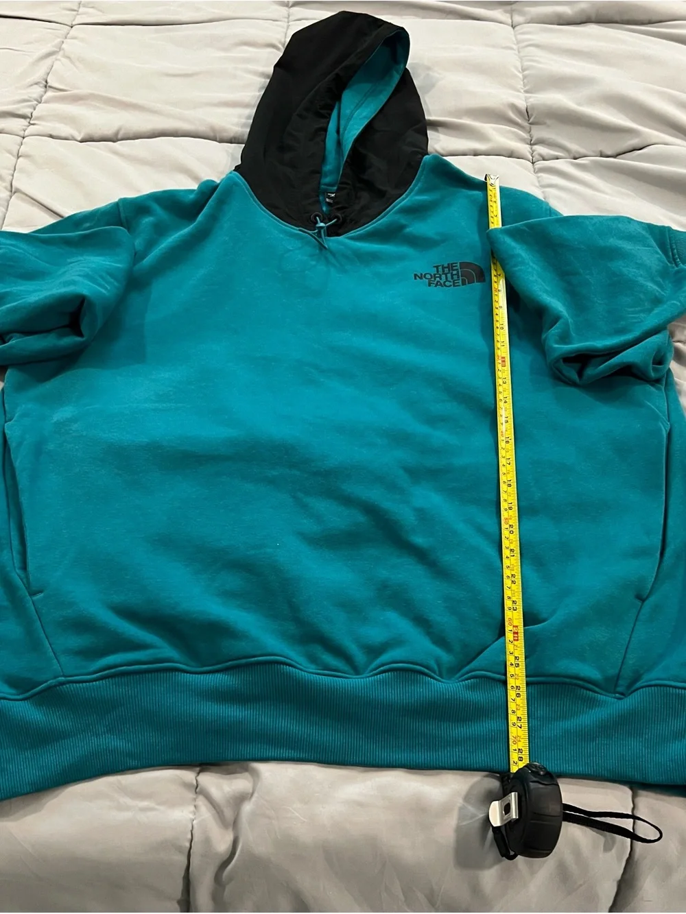 The North Face  Me's Teal Hoodie pullover with Black Hood snd pockets size XL.